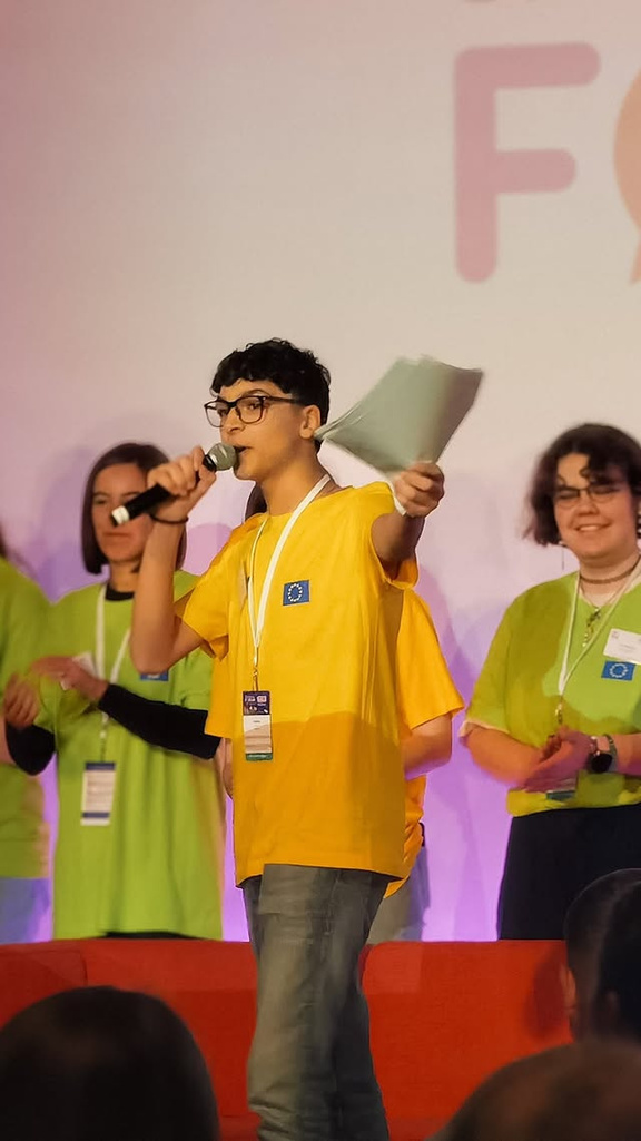 Speaking on stage at a European youth event